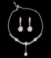Collar y aros, flor brillante